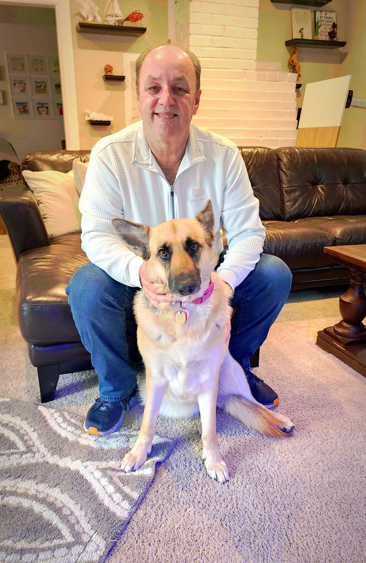 Chris Johnson at home with his German Shepherd