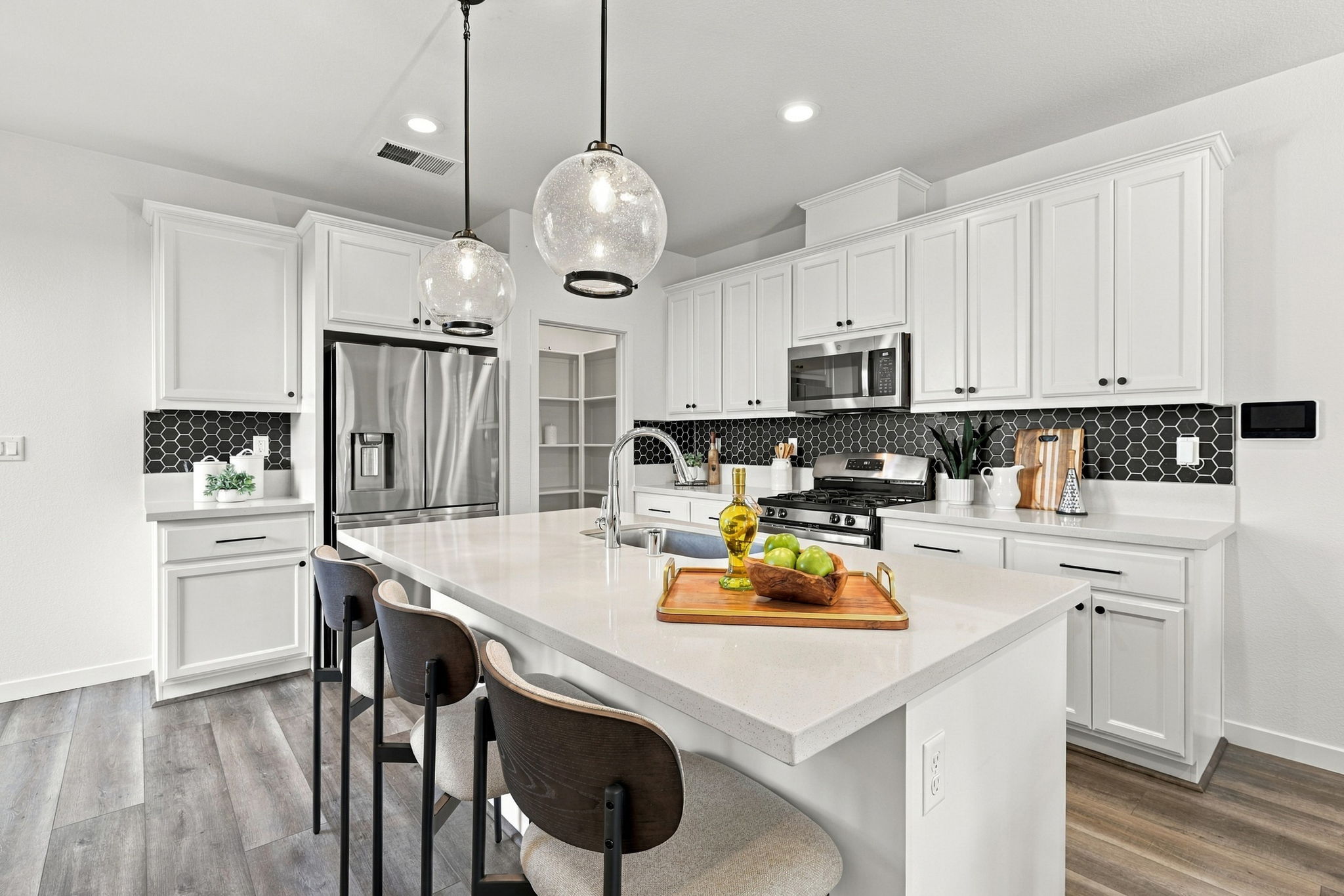 1230 Qualteri Way - Kitchen with white cabinetry, center island, and pendant lighting