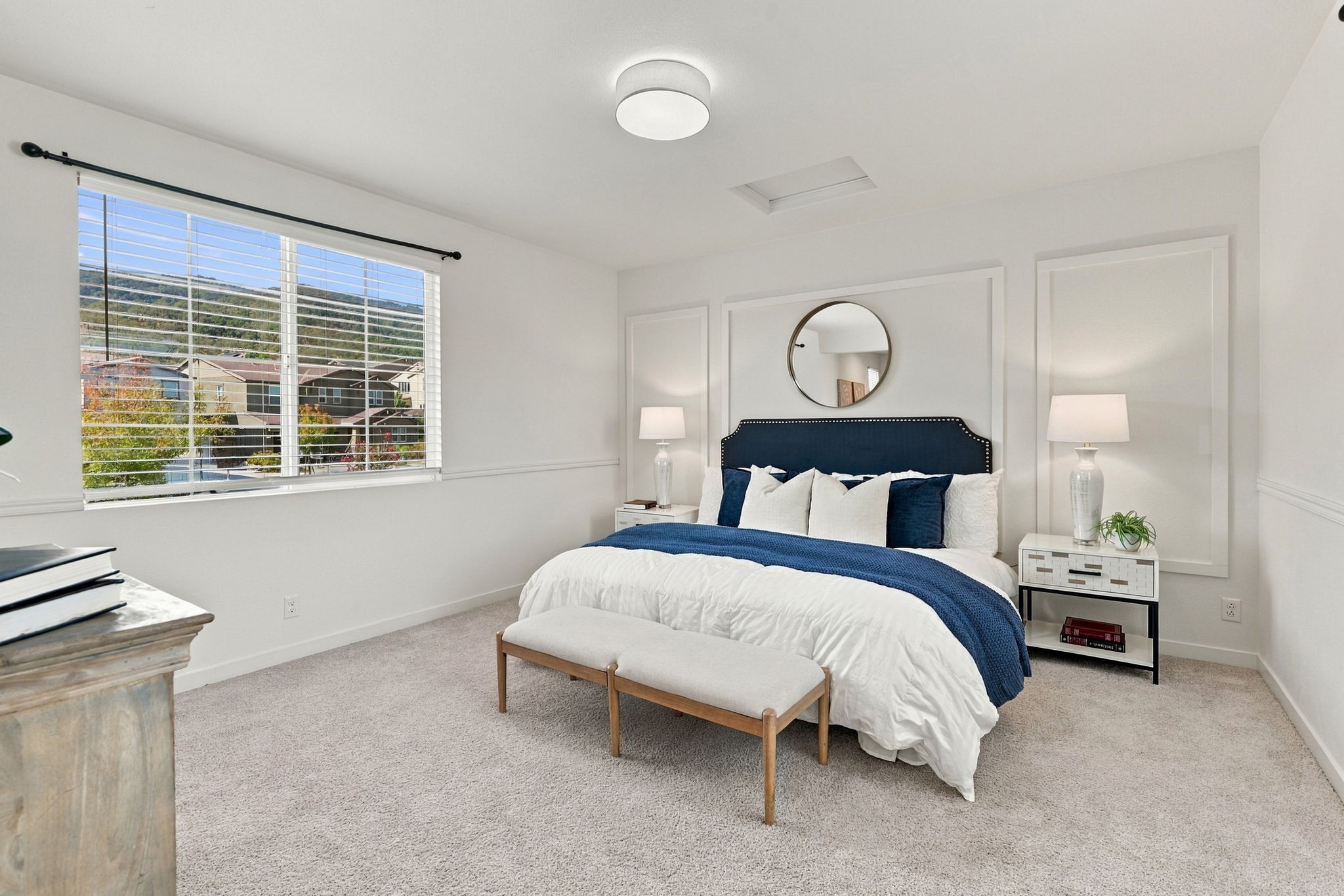 1230 Qualteri Way - Bedroom with navy headboard and window shutters